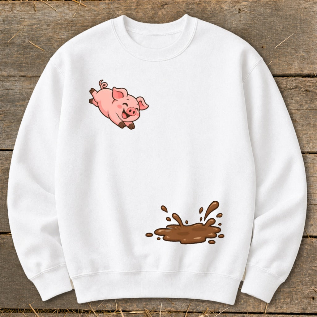 White sweatshirt with a cartoon pig jumping over a mud puddle graphic.