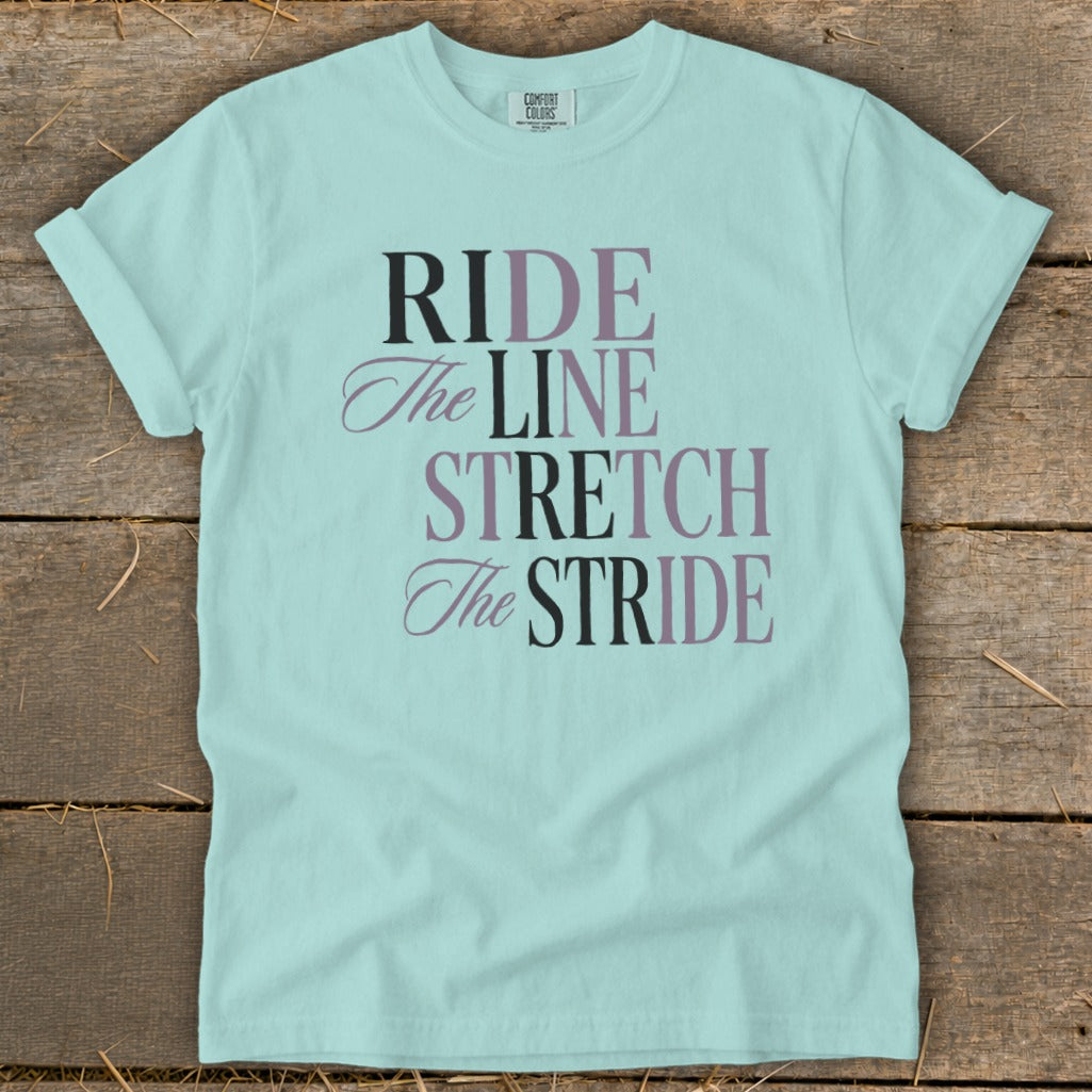Light blue t-shirt with "RIDE The LINE STRETCH The STRIDE" text.