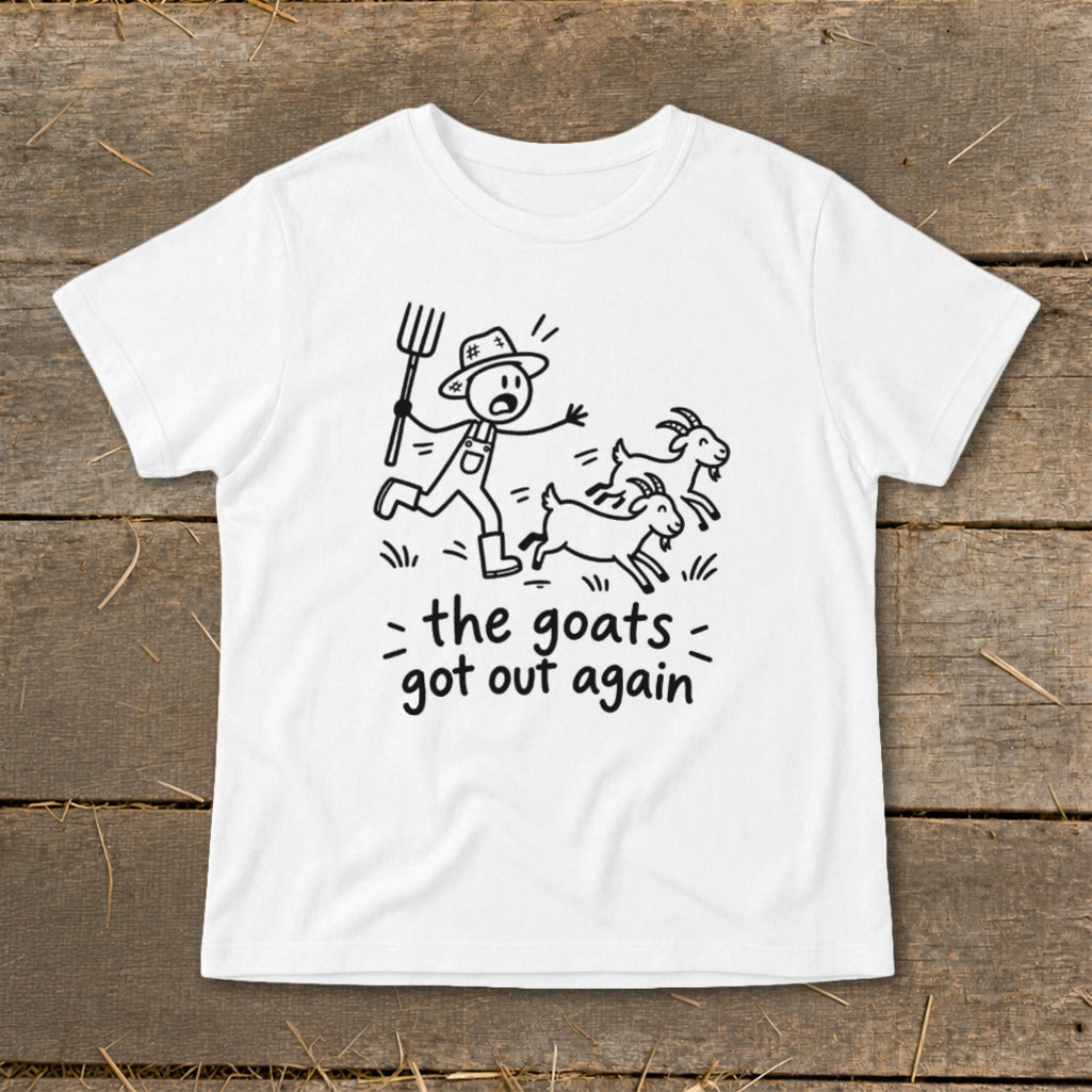 White t-shirt with black line drawing of farmer chasing goats, text reads "the goats got out again".