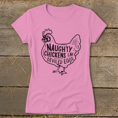Pink t-shirt with black illustration of a chicken and text "Naughty Chickens Lay Deviled Eggs".