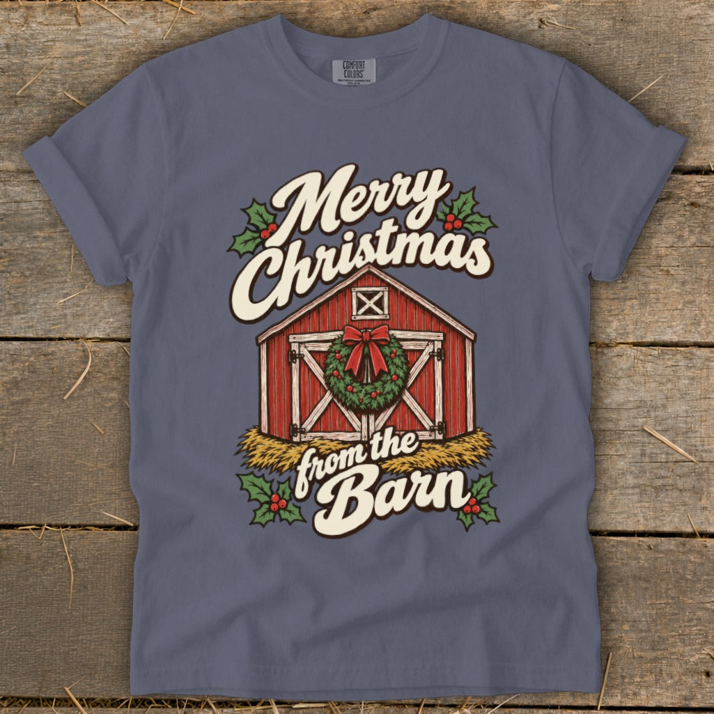 T-shirt graphic with red barn, wreath, holly, and text "Merry Christmas from the Barn".