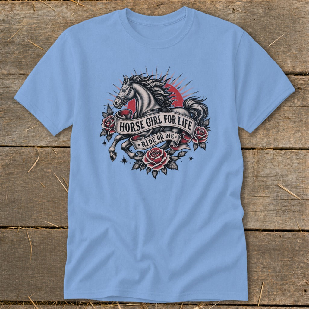 Light blue t-shirt with a vintage tattoo design of a horse, roses, and banner text.
