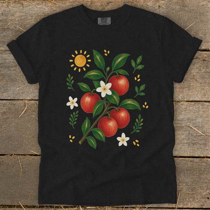 Black t-shirt with a watercolor illustration of red apples and white blossoms on a branch.