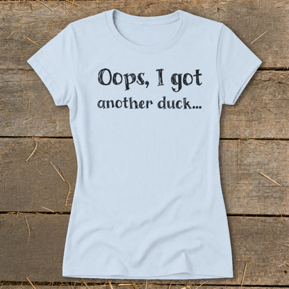Light blue t-shirt with black text reading "Oops, I got another duck..."