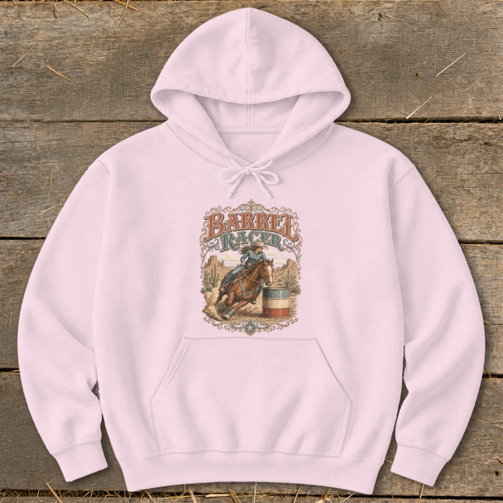 Pink hoodie with "Barrel Racer" graphic featuring a woman riding a horse around a barrel.