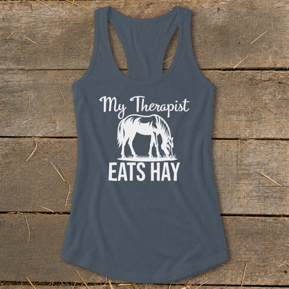 Tank top with white text "My Therapist EATS HAY" and horse graphic.