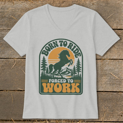 T-shirt with graphic of horse, mountains, trees, and text "BORN TO RIDE FORCED TO WORK."