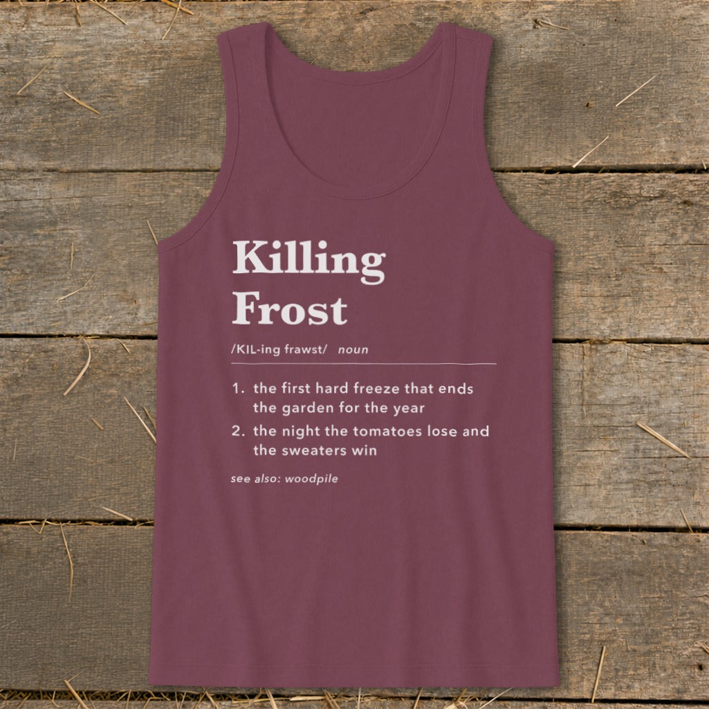 Maroon tank top printed with a dictionary definition of Killing Frost laid flat on a rustic wooden surface.