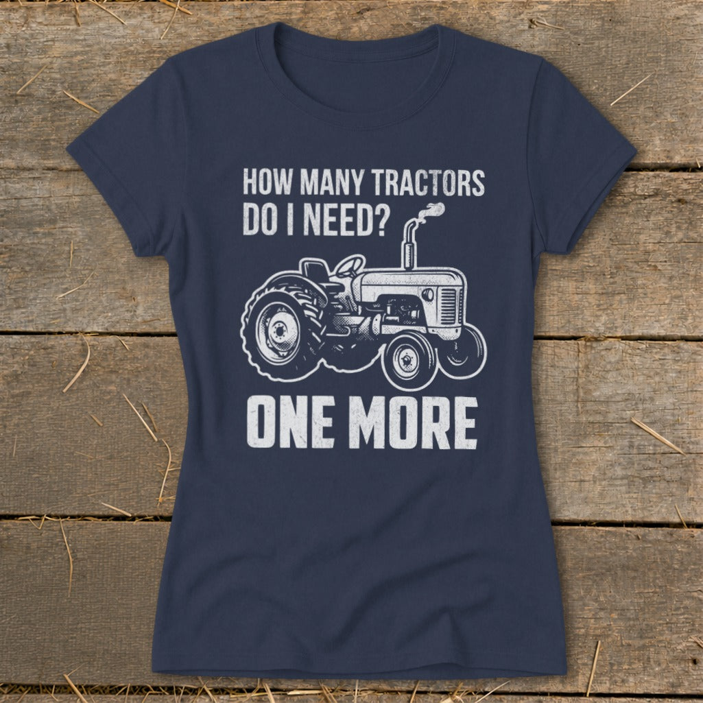 Navy t-shirt with white text and tractor graphic: "HOW MANY TRACTORS DO I NEED? ONE MORE"