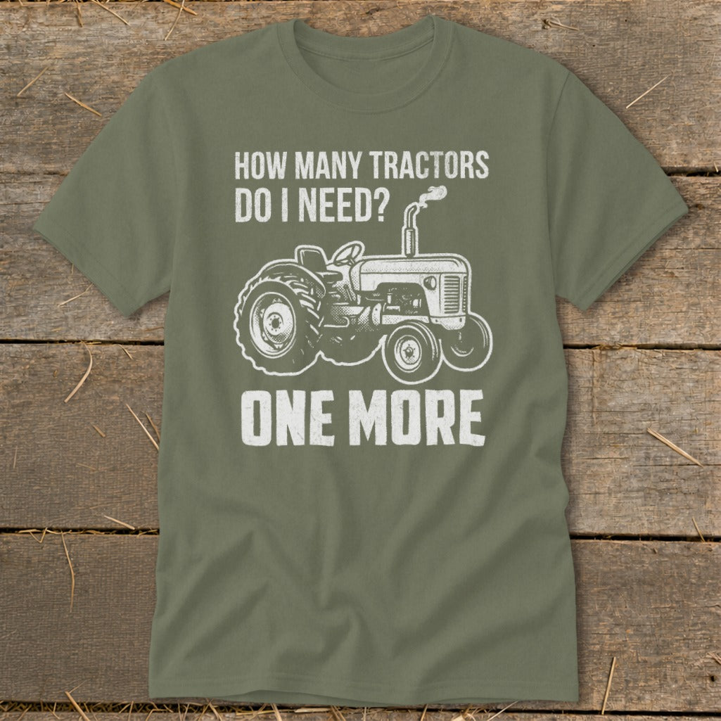 Green t-shirt with graphic "How Many Tractors Do I Need? One More" and tractor illustration.
