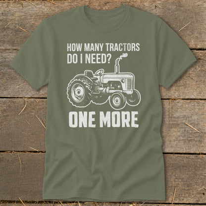 Green t-shirt with graphic "How Many Tractors Do I Need? One More" and tractor illustration.