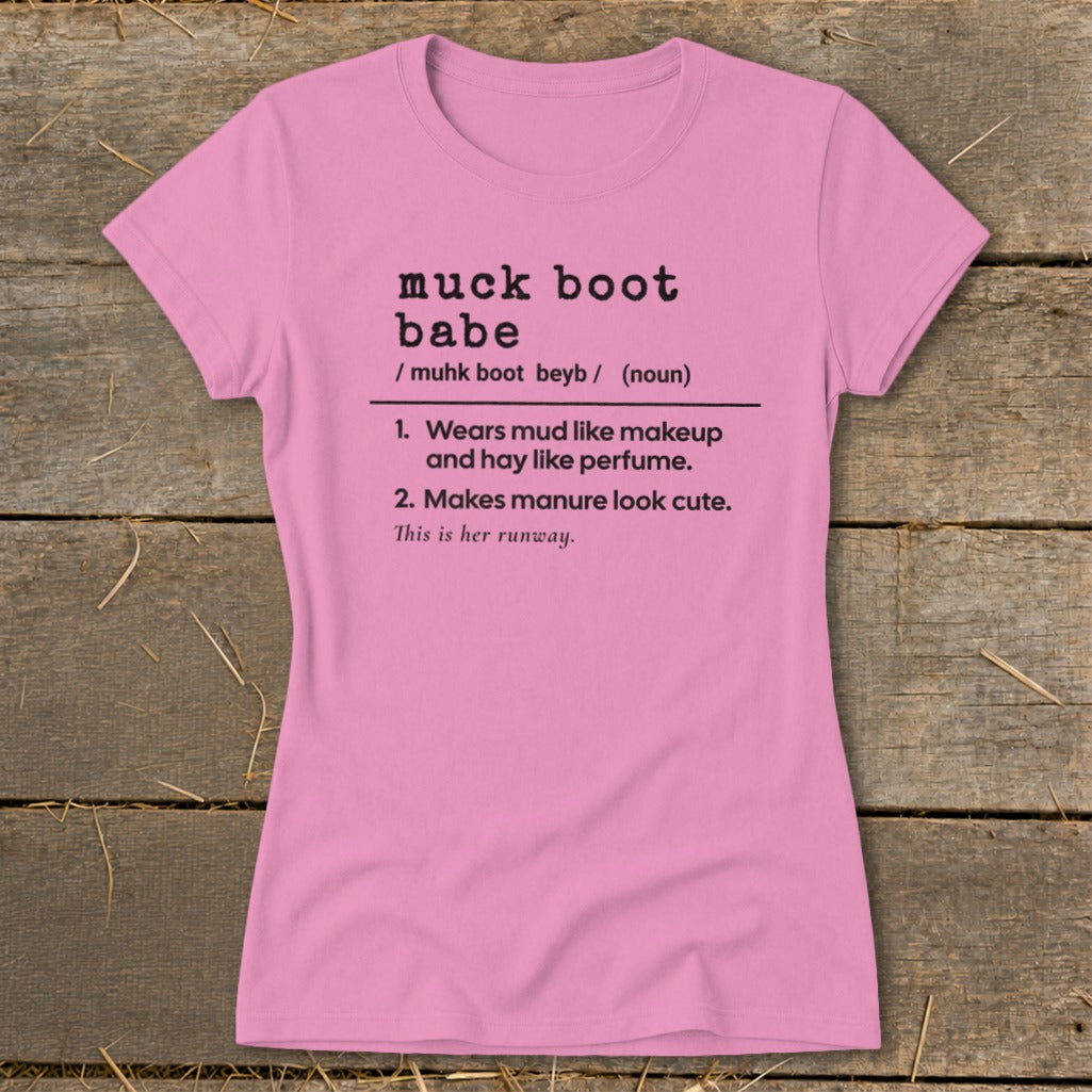 Pink t-shirt with "muck boot babe" definition including "Wears mud like makeup and hay like perfume."