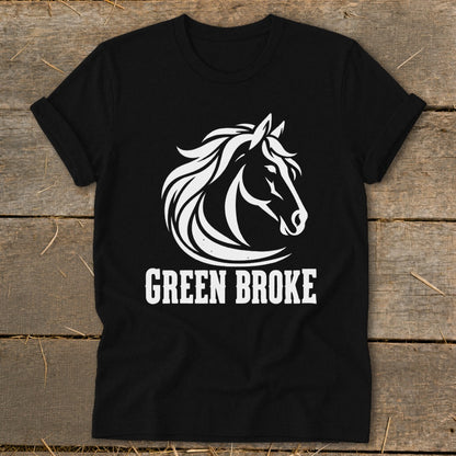 A black t-shirt features a white graphic of a horse head and the text GREEN BROKE.