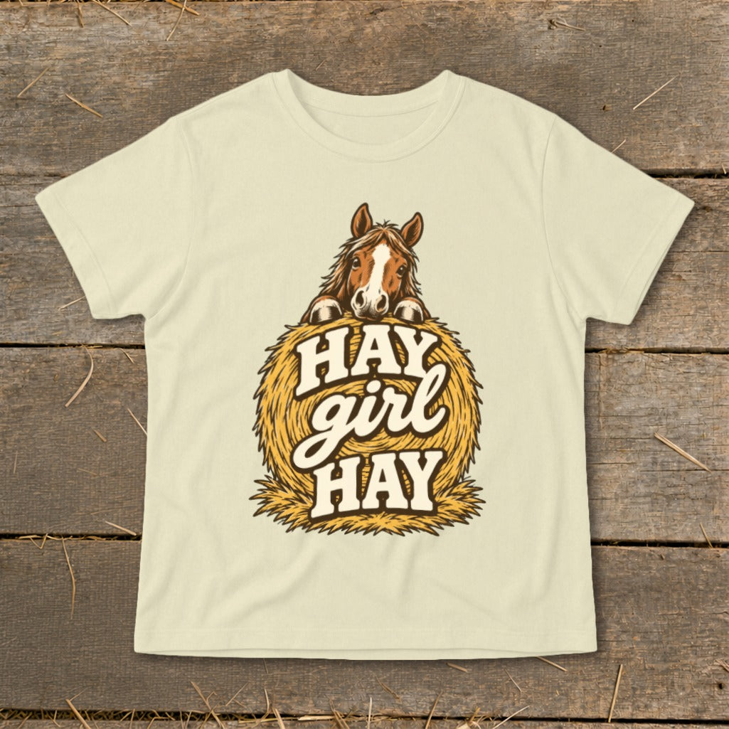 Horse peeking over a hay bale with "Hay girl hay" text.