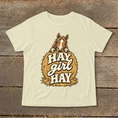 Horse peeking over a hay bale with "Hay girl hay" text.
