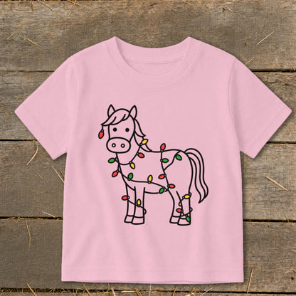 Pink t-shirt with a black outline drawing of a horse wrapped in colorful Christmas lights.