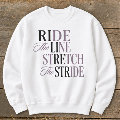 White sweatshirt with the text "RIDE The LINE STRETCH The STRIDE" in varying fonts and colors.