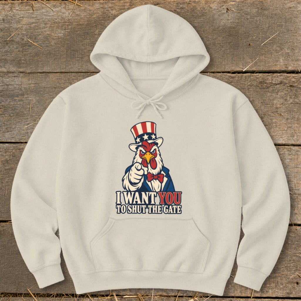 Cream hoodie with a rooster in a top hat pointing and the text "I WANT YOU TO SHUT THE GATE".