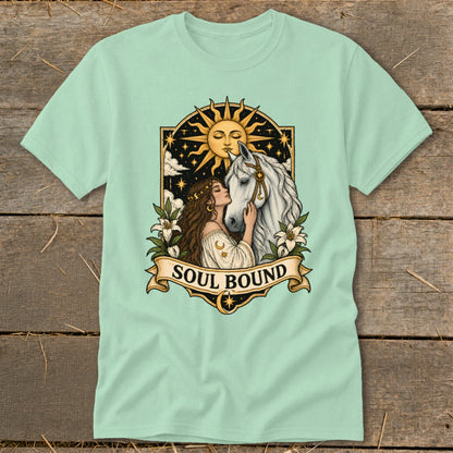 Mint t-shirt with "Soul Bound" text and illustration of a woman with a horse under a sun and stars.