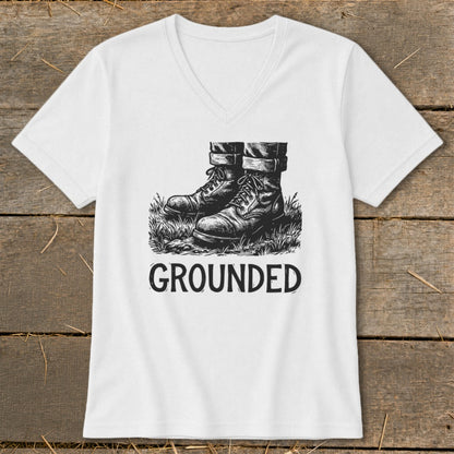 White t-shirt with sketch of boots in grass and the word GROUNDED.