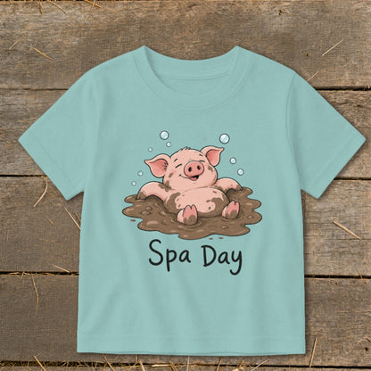 Cute pig enjoying a mud spa day, text "Spa Day" printed below.