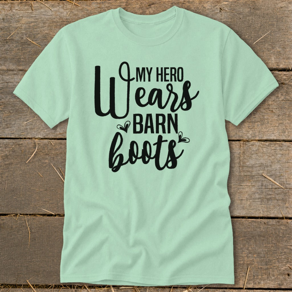 Light green t-shirt with black text reading "My Hero Wears Barn Boots".