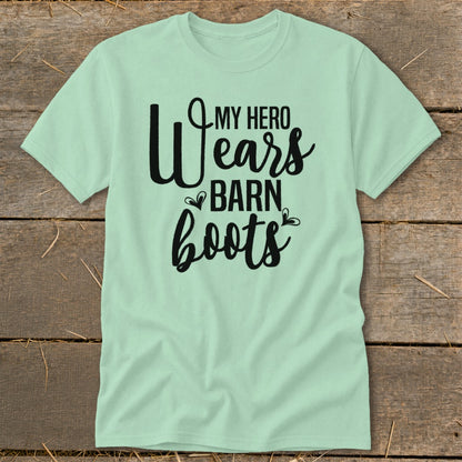 Light green t-shirt with black text reading "My Hero Wears Barn Boots".