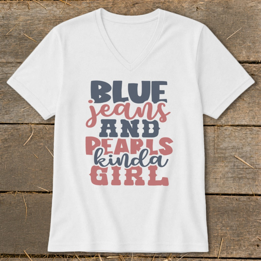 White v-neck t-shirt with "BLUE JEANS AND PEARLS KINDA GIRL" text graphic.