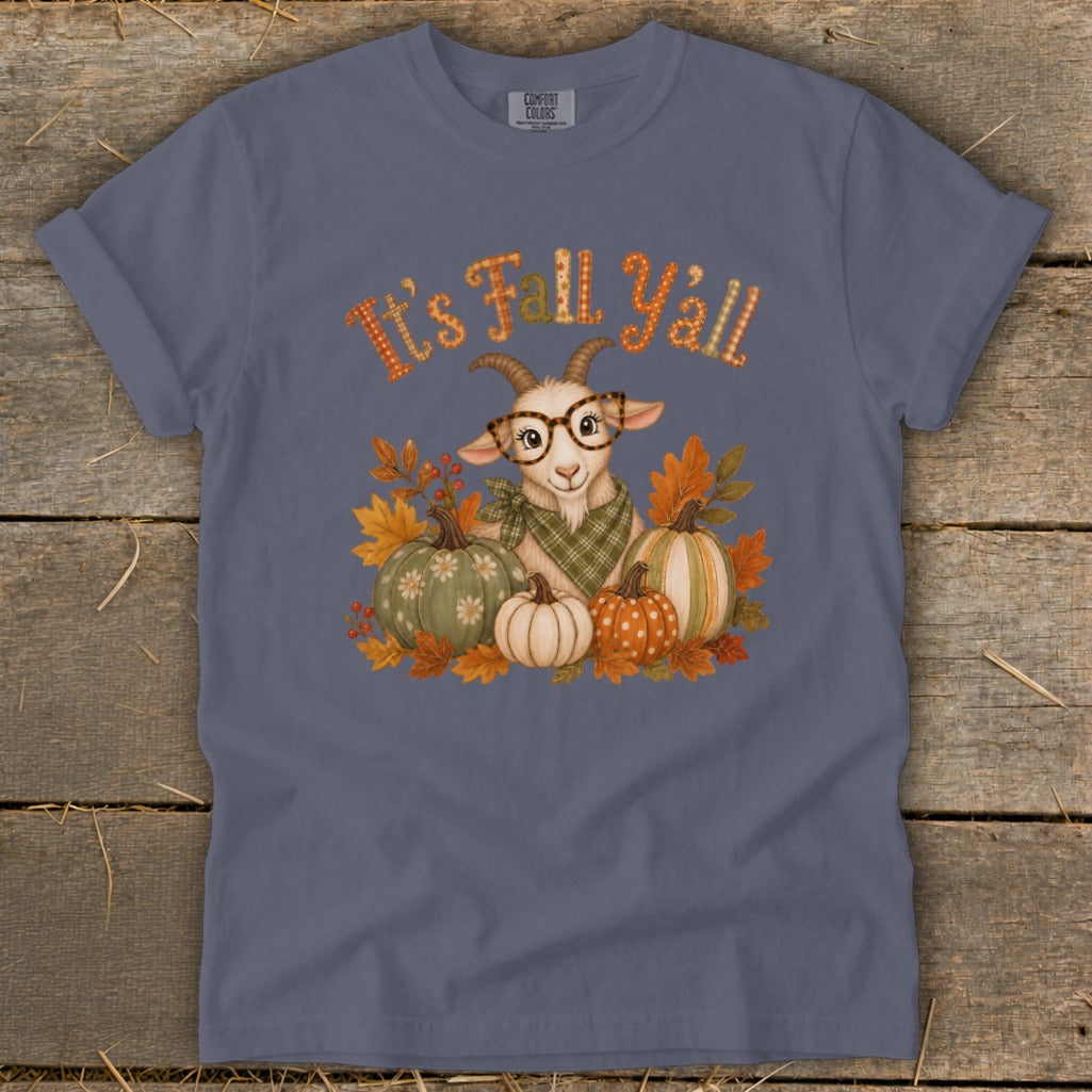 Goat with glasses and pumpkins on a t-shirt with "It's Fall Y'all" text.