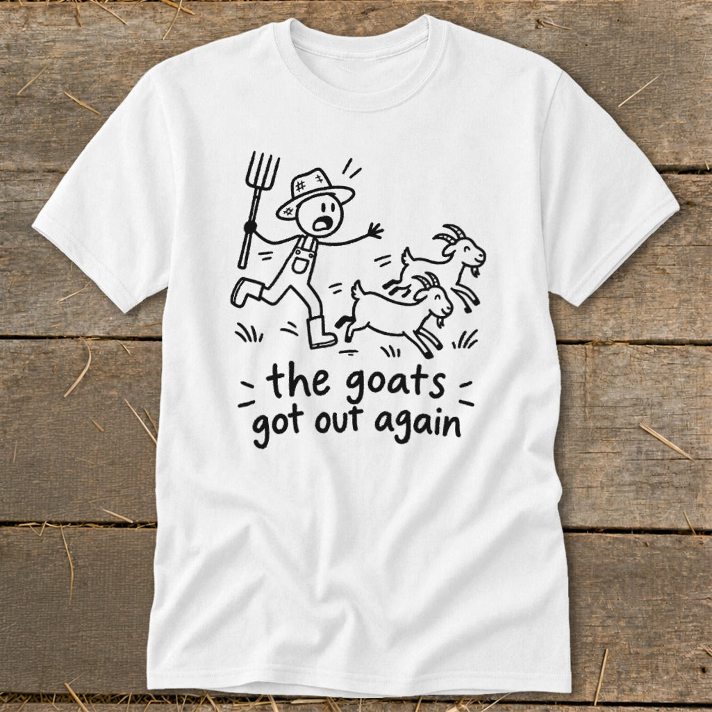 White t-shirt with cartoon farmer chasing three goats, text reads "the goats got out again".