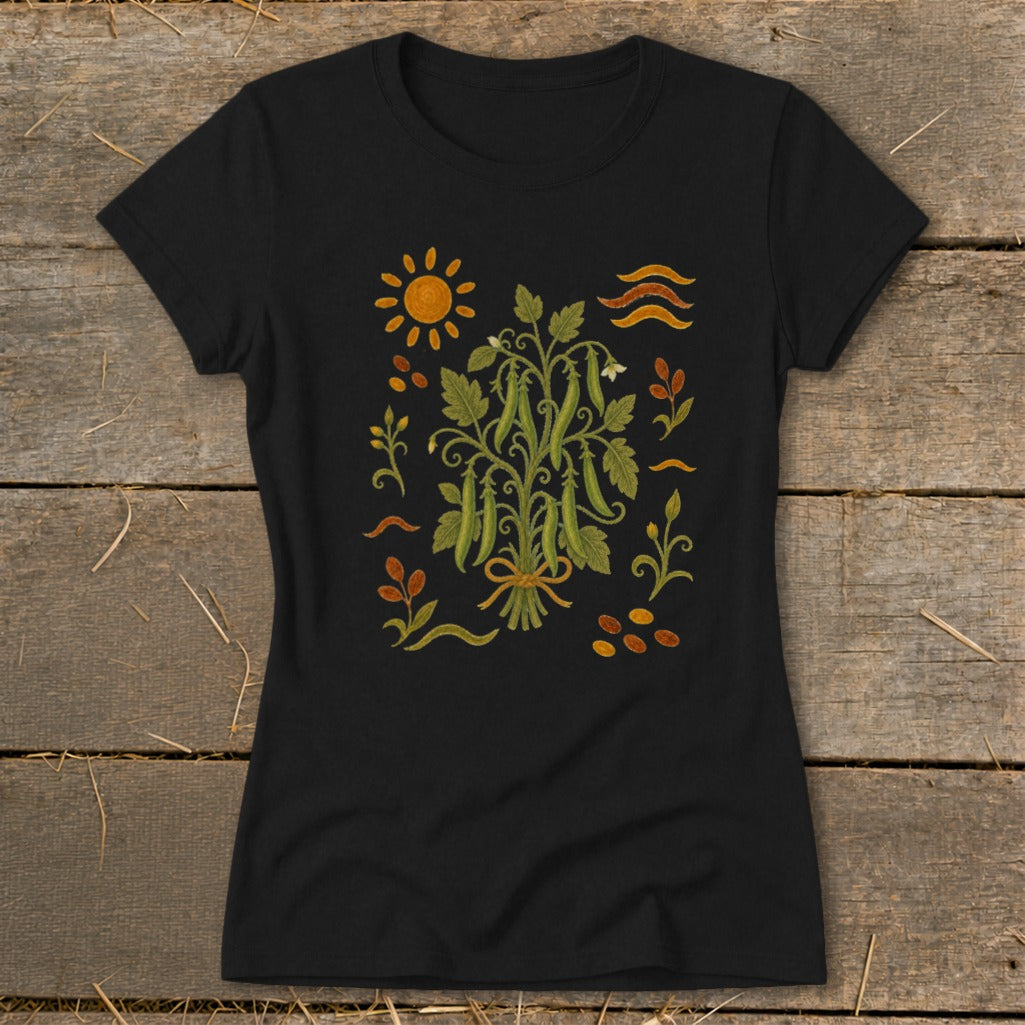 Black t-shirt with a stylized illustration of a pea plant and garden elements.