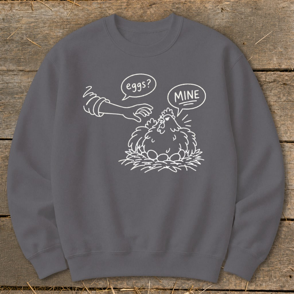 Chicken with eggs in nest, reaching hand asks "eggs?", chicken replies "MINE".