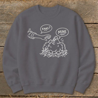 Chicken with eggs in nest, reaching hand asks "eggs?", chicken replies "MINE".