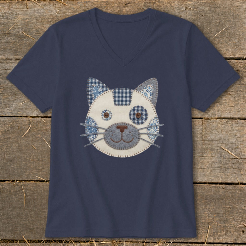 Navy v-neck t-shirt with a blue and white patchwork cat face applique.