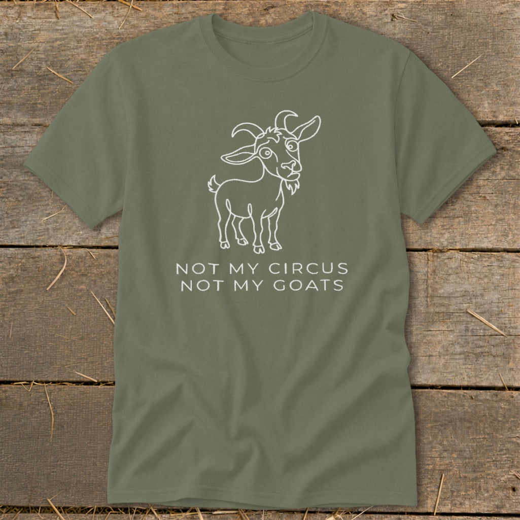 Olive green t-shirt with a white line drawing of a goat and text that reads "NOT MY CIRCUS NOT MY GOATS."