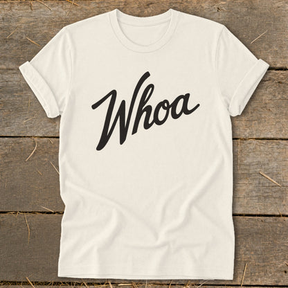Cream t-shirt with black script text that says "Whoa"