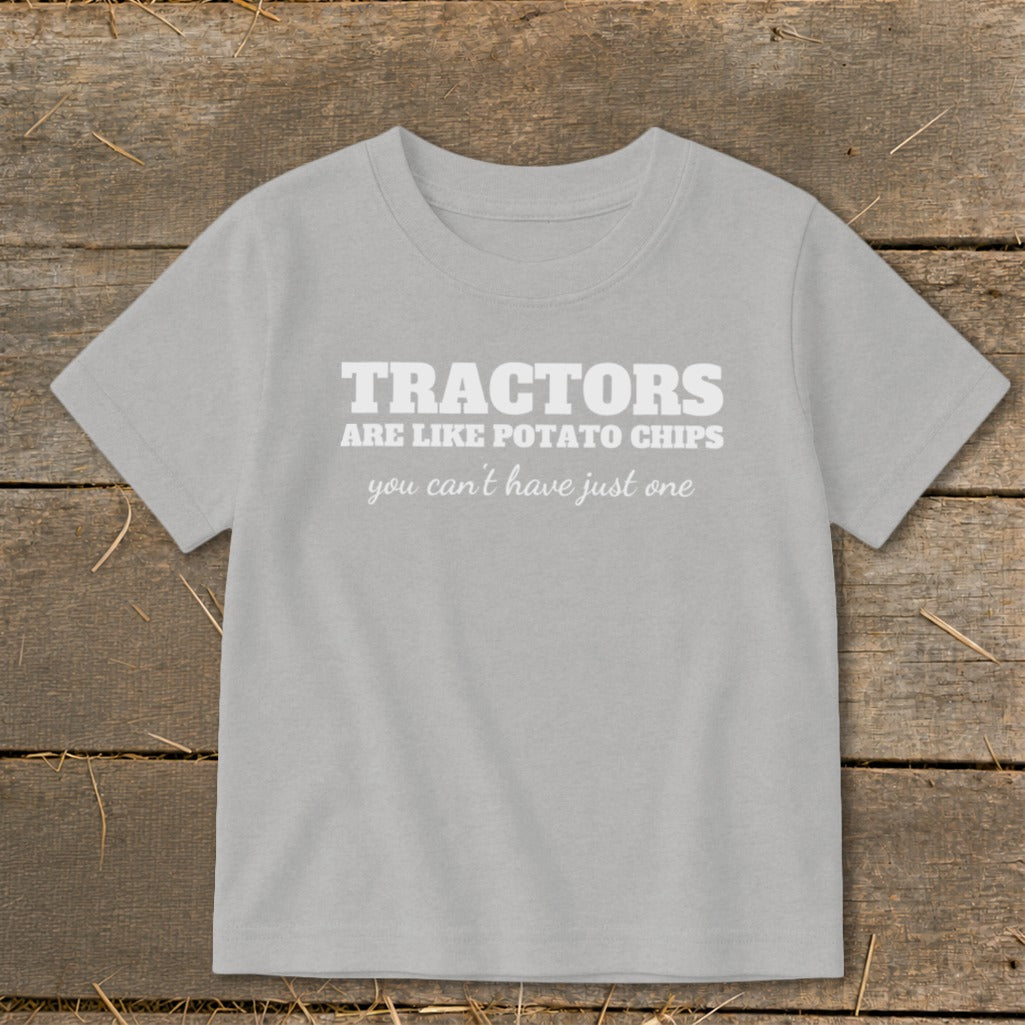 Light gray t-shirt with white text "TRACTORS ARE LIKE POTATO CHIPS you can't have just one".