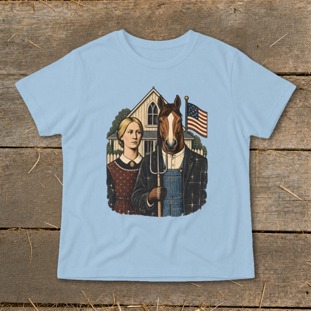 A light blue t-shirt printed with a satirical take on American Gothic featuring a woman and a horse-headed man holding a pitchfork.