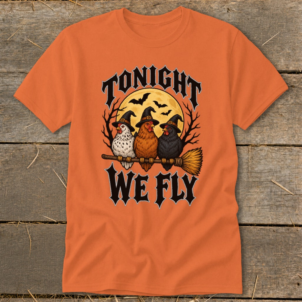 Three chickens in witch hats ride a broomstick with "Tonight We Fly" text.