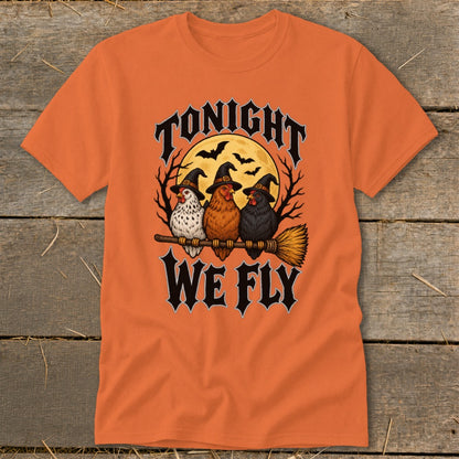 Three chickens in witch hats ride a broomstick with "Tonight We Fly" text.