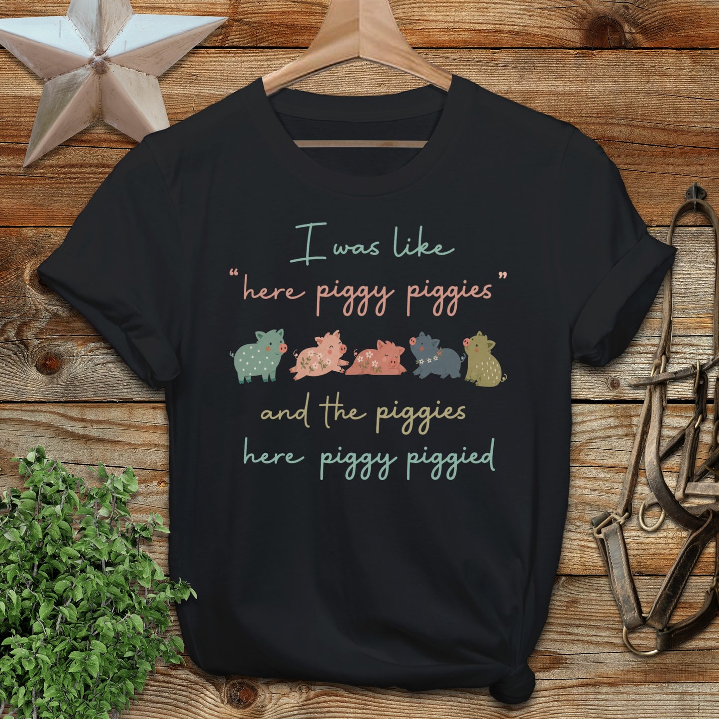 Black t-shirt with "I was like 'here piggy piggies' and the piggies here piggy piggied" text.