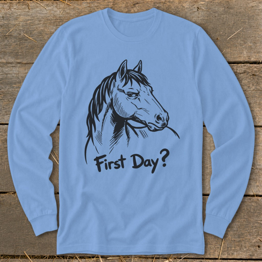 Light blue long-sleeve shirt with a black horse illustration and text "First Day?".