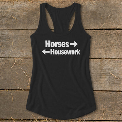 A black racerback tank top with white text that reads Horses with a right arrow and Housework with a left arrow.