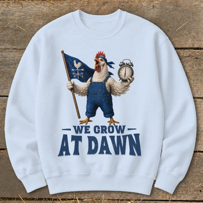 Chicken in overalls holds flag and alarm clock, text "WE GROW AT DAWN".