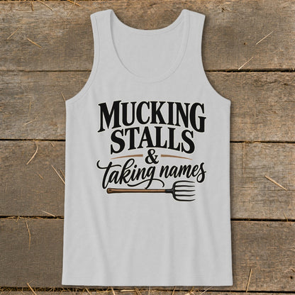 Tank top with "Mucking Stalls & Taking Names" text and a pitchfork graphic.