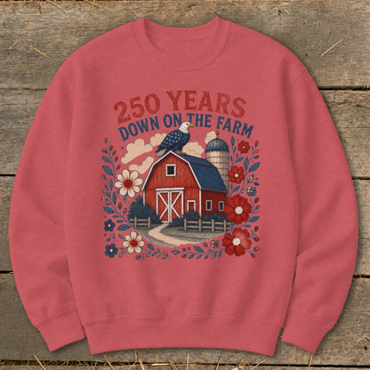 Red sweatshirt with farm, eagle, and patriotic floral design. "250 Years Down on the Farm" text.