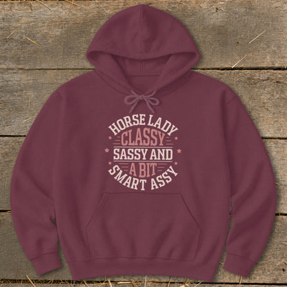 Maroon hoodie with "Horse Lady Classy Sassy and a Bit Smart Assy" graphic.