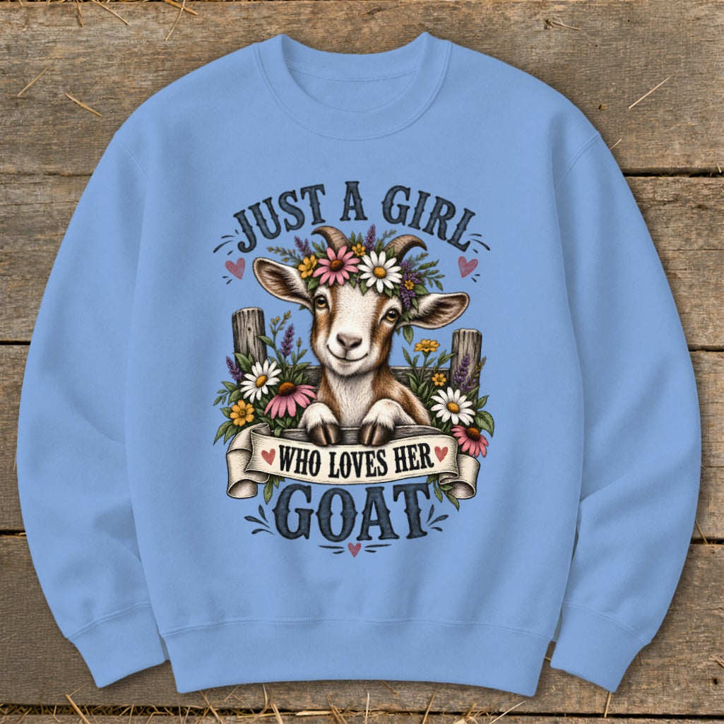 Light blue sweatshirt with a watercolor goat wearing flowers and text.