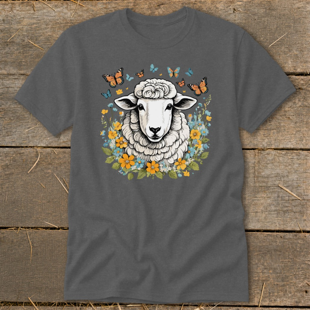 Sheep surrounded by flowers and butterflies graphic on a charcoal grey t-shirt.