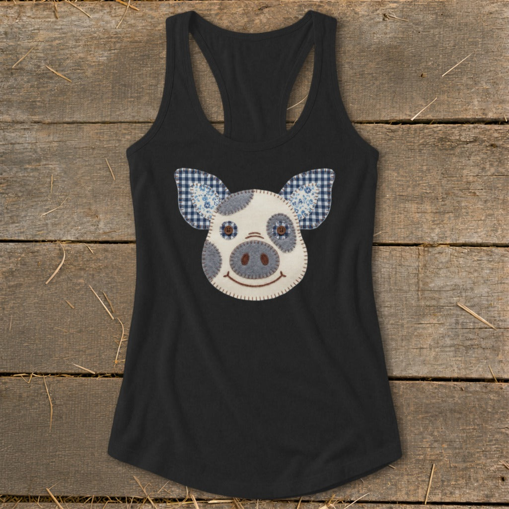 Black tank top with a stitched pig face applique and gingham ears.